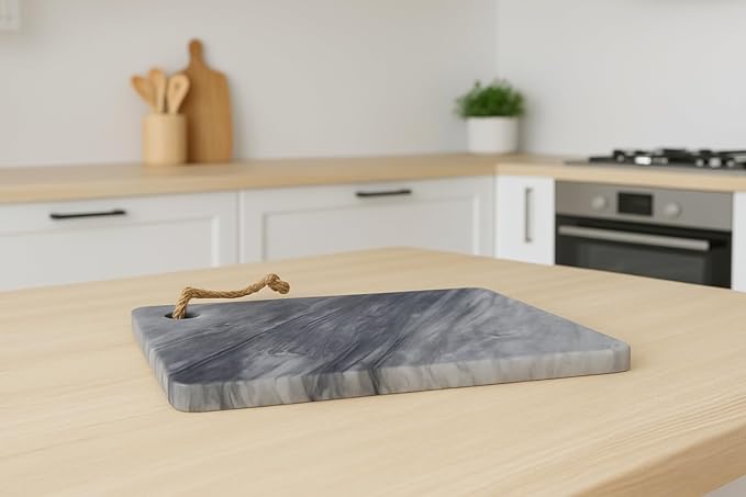 Carrara marble cutting board displayed in modern kitchen interior