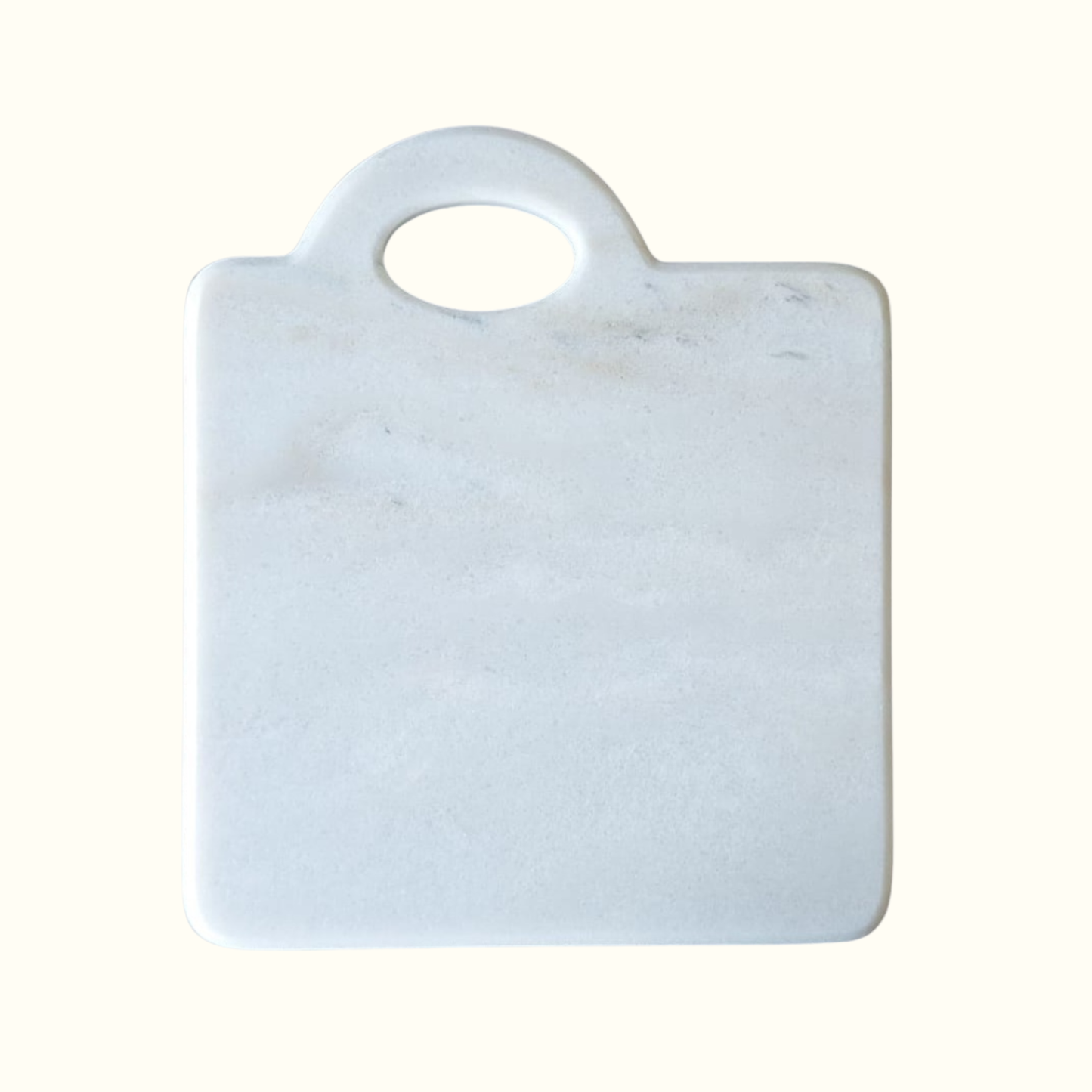 White marble cutting board with handle, handcrafted in Italy, minimalist kitchen design